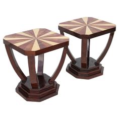 two wooden tables with geometric designs on them