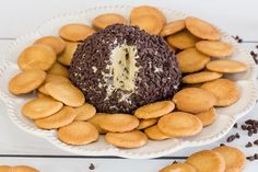 a cake with chocolate chips around it on a plate