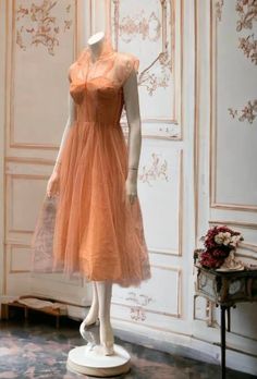 Beautiful one of a kind peach dress, silk lined with rhinestones strewn along the crinoline over slip.  Collared with a v neck.  All rhinestones intact. Talon metal zipper down side, belted.  No label.  Beautiful condition.  Measurements: shoulder 17", underarm 32", waist 24", hip 35" length 45". belt length 27" Peach Dress, Belt Length, Peaches N Cream, Dress Silk, Rhinestone Dress, Barbie Dress, Beautiful One, Metal Zipper, Dress Clothes For Women