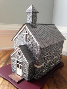 a paper model of a church on top of a mat