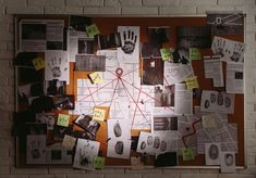 a bulletin board covered in papers and pictures