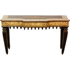 an ornate wooden table with gold leaf designs on the top and bottom, against a white background