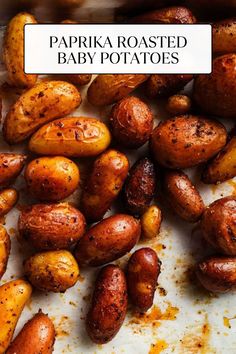 some baby potatoes that have been roasted and are on a white surface with the words papika roasted baby potatoes