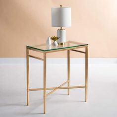 a glass table with a lamp on top