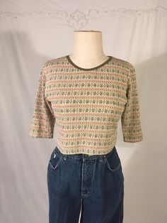 "vintage 1990s crop top shirt Girl Code cotton blend feel cream white background w/avocado green stripes, chestnut brown exes, brown diamonds and snowflakes puckered weave jersey brown neck trim 1/2 sleeve good vintage condition, light wear label doesn't say size, see below measures, lying flat, shoulder-13 1/2\" chest-17\" to 21\" stretched sleeve-12\" length-15 1/2\"     We do not offer returns or refunds unless something is grossly misrepresented. Please contact us within 2 business days of receiving to discuss any possible returns for this reason. We do not offer refunds for your shipping fees. Please feel free to contact us with any questions you may have about an item prior to purchase and we will gladly answer them." Affordable Vintage Tops For School, 80s Tops, Thrift Wishlist, Jersey Crop Top, Half Sleeve Shirt, Brown Diamonds, 90s Girl, Girl Code, Retro 60s