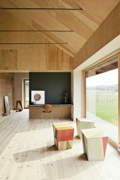 an open room with wooden walls and flooring