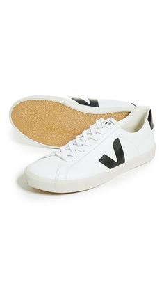 Leather: CowhideCushioned insoleContrast heel and logoLining is a blend of soft cotton and recycled plastic water bottlesSole made of Amazonian rubber, rice waste, and recycled rubberLace-up closureImported, BrazilThis item cannot be gift-boxedStyle #VEJAA30069These casual Veja sneakers are rendered in rich leather and accented with contrast branding at the sides. Veja Esplar, Plastic Water Bottles, Veja Sneakers, Recycled Rubber, Recycled Plastic, Leather Sneakers, Water Bottles, Brazil, New Arrivals