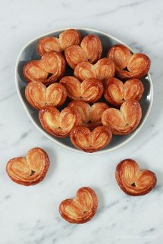 small pastries in a bowl on a marble table