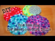 four pom - pom rugs for american girl dolls on a wooden table