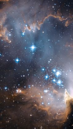 the large star cluster in the sky is surrounded by bright blue and white stars,