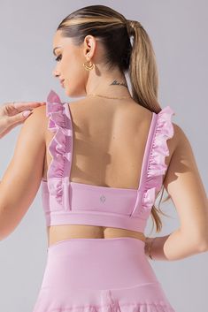 It’s a sports bra straight out of a romance novel. This bra features the most romantic, ruffled shoulder straps, a daring square neckline, and a flirty low back. Compression Level:  Performance Level: Feminine Workout Clothes, Girly Workout Outfits, Feminine Sportswear, Gymnastics Fits, Cute Workout Sets, Athletic Sets, Running Sets, Ruffle Bra, Running Fits