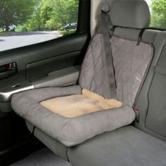 the interior of a car with a dog bed in it