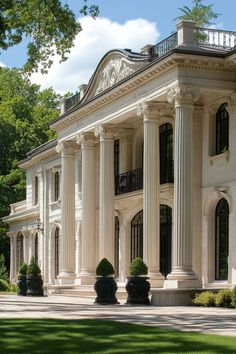 a large white house with columns and pillars