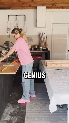 a woman standing in front of a kitchen counter with the words genius above her head