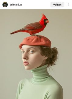 a woman wearing a red hat with a bird on top of her head in front of a white background