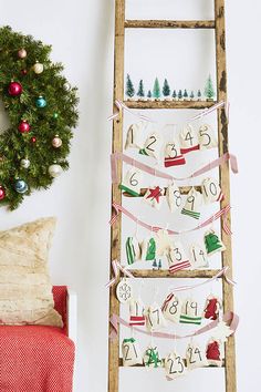 an old ladder is decorated with christmas decorations