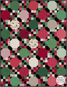 a quilt made with red, green and black squares