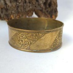 jewelry Bracelet Vintage African Bronze Berber Old Ethnic African Antique Engraved Moroccan Bracelet Hippy boho Womens Bangle Ethnic This breathtaking vintage bracelet is a perfect illustration of Traditional African craftsmanship. It has been made using bronze and brass, the large bangle is a showcase of rich cultural heritage and unique skill of the berber people. This vintage bracelet epitomizes excellent African and Moroccan jewelry development. It consists of bronze and brass with a massive Bohemian Brass Jewelry For Rituals, Bohemian Brass Bracelet Jewelry, Bohemian Brass Bracelet, Bohemian Antique Gold Bracelets For Gift, Bohemian Festival Toe Ring Jewelry, Bohemian Style Toe Ring For Festivals, Bohemian Style Festival Toe Ring, Bohemian Toe Ring For Festivals, Bohemian Metal Jewelry For Ceremonial Occasions