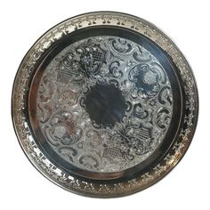 a silver plate with ornate designs on it