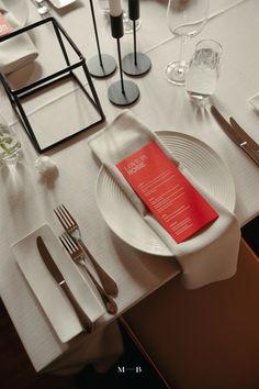 a table set with place settings and silverware