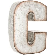 an old rusty metal letter g on a white background