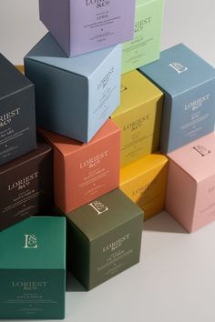 Twelve beautifully scented candles in twelve different richly coloured boxes Candles Branding, Candle Making Fragrance, Beautiful Scented Candles, Photography Set Up, All The Months, Luxury Packaging Design, Tapered Candles, Small Business Plan