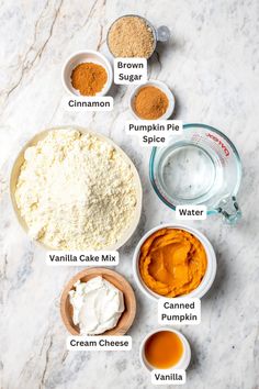 ingredients to make pumpkin pie laid out on a marble counter top with the names below