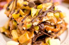 a white plate topped with lots of chocolate and fruit