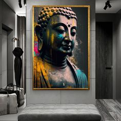 a large buddha statue sitting on top of a wooden floor next to a gray couch