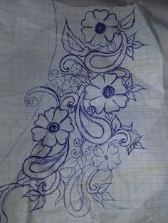 a piece of paper that has some flowers on it and is drawn in blue ink