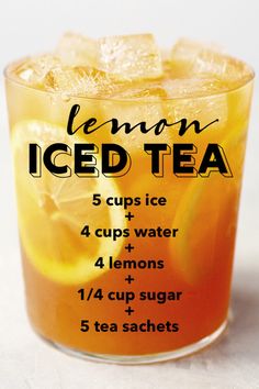 a glass filled with lemon iced tea on top of a table