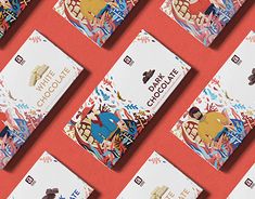 the chocolate bar packaging design is laid out on a red surface with different designs and colors