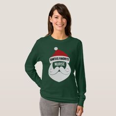 a woman wearing a green santa's favorite nurse sweatshirt