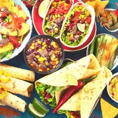 mexican food is laid out on a table