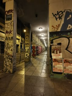 an alley with graffiti all over the walls