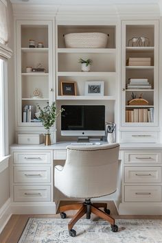 a home office with built - in shelving, desk and chair