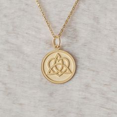 Gold Heart Triquetra Knot Pendant - Triquetra Knot Gold Necklace ● Material of pendant: Solid Gold 14k ( REAL GOLD ) ● Metal Stamp: 14k ( REAL GOLD ) ● The pendant is available in 5 sizes: - 12,7 mm / 0.5 inches (Diameter) - 14,0 mm / 0,55 inches ( Diameter ) In the photos - 15,3 mm / 0.6 inches ( Diameter ) - 16,5 mm / 0,65 inches ( Diameter ) - 19,1 mm / 0,75 inches ( Diameter ) ( In the photos the size is 14mm / 0.55 inches Diameter ) ( Jump Ring inner diameter: 4 mm ) ● Material of chain: Solid gold 14k ( REAL GOLD ) It is thin and dainty and it is available in 4 sizes: - 40 cm / 15,75 inches ( Length ) - 45 cm / 17,72 inches ( Length ) In the photos - 50 cm / 19,68 inches ( Length ) - 55 cm / 21,65 inches ( Length ) ● Backside engraving is FREE ( Please use the personalization box for Irish Knot, Celtic Knot Necklace, Knot Necklace, Necklace Personalized, Gold Heart, Celtic Knot, Heart Of Gold, Necklace Gift, Metal Stamping