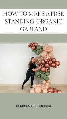 a woman standing in front of a giant balloon sculpture with the words how to make a free standing organic garland