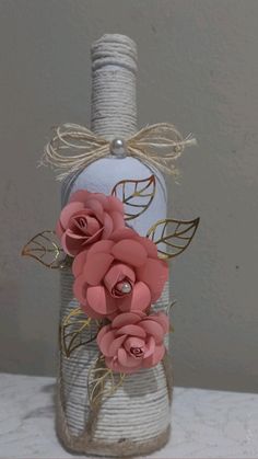 a bottle that has some flowers in it