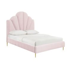 a bed with a pink headboard and white sheets