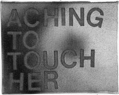 there is a sign that says reaching to touch her