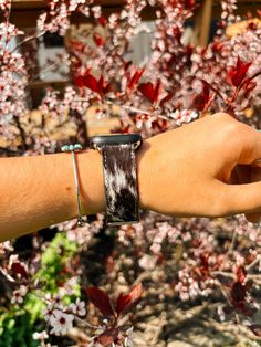 Stand out from the herd with our Black & White Cowhide Watch Band. Made from genuine cowhide, this band is designed to bring a touch of western flair to your Apple Watch It fits 38mm/40mm/41mm Hides will vary in print, cowhide products are made to be handled with care, shedding of hair is natural THIS ITEM IS FINAL SALE Western Apple Watch Bands, Western Apple Watch Band, Western Apple Watch, Apple Watch Cuff, Cuff Watch, Cow Hide, Beaded Choker, Apple Watch Band, Watch It