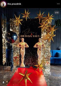 a red carpet with two golden stars on it and an award for the best birthday party