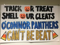 a sign that says trick or treat smell our cleats o'connor panthers can't be beat