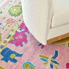 a pink rug with an elephant design on it