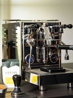 an espresso machine sitting on top of a counter