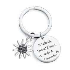 a keychain with a flower on it that says it takes a special person to be a consolor