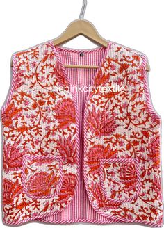 Pink Cotton Vest For Fall, Pink Sleeveless Cotton Vest, Multicolor Cotton Winter Vest, Pink Sleeveless Vest With Pockets, Fitted Pink Cotton Outerwear, Pink Sleeveless Cotton Outerwear, Pink Vest Outerwear For Spring, Red Sleeveless Cotton Outerwear, Sleeveless Red Cotton Outerwear