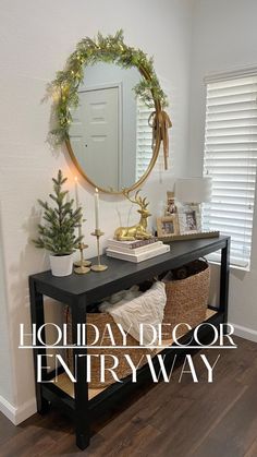 the entryway is decorated for christmas with holiday decor