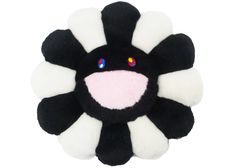 a black and white flower with multi colored eyes